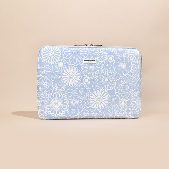 Baby blue laptop sleeve with white floral pattern from Coconut Lane.