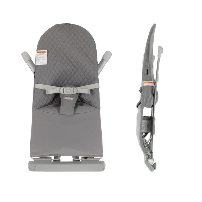 The Baby Bouncer Seat | Grey is shown from the front and side, featuring quilted fabric, a safety harness, foldable frame, and orange warning labels. The side view highlights its slim, compact fold.