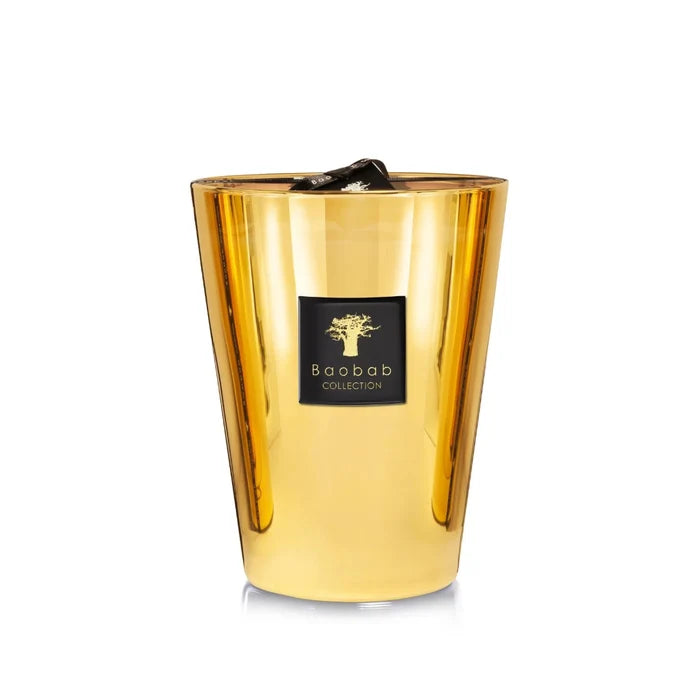 A collection of gold colored candles with glass containers, each with a label reading 'Baobab'.