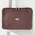Brown and blue polka dot design Laptop Sleeve with silver zip and Coconut Lane logo badge.