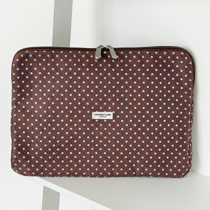 Brown and blue polka dot design Laptop Sleeve with silver zip and Coconut Lane logo badge.
