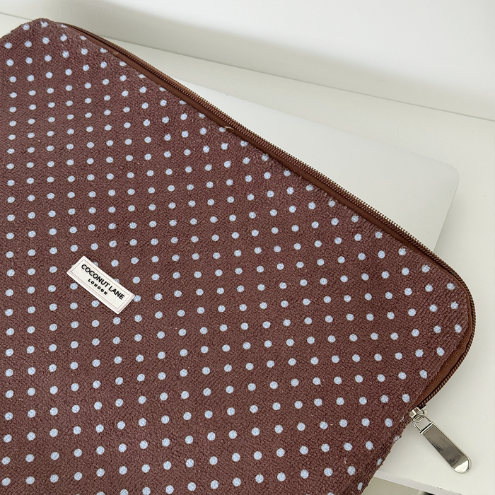 Brown and blue polka dot design Laptop Sleeve with silver zip and Coconut Lane logo badge.