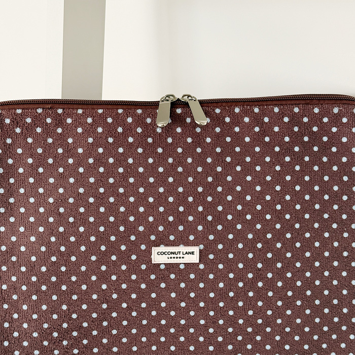 Brown and blue polka dot design Laptop Sleeve with silver zip and Coconut Lane logo badge.