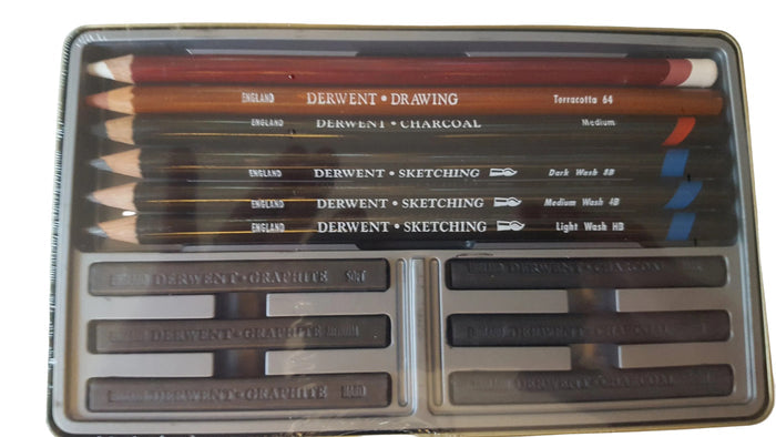 Set of charcoal pencils in a metal case