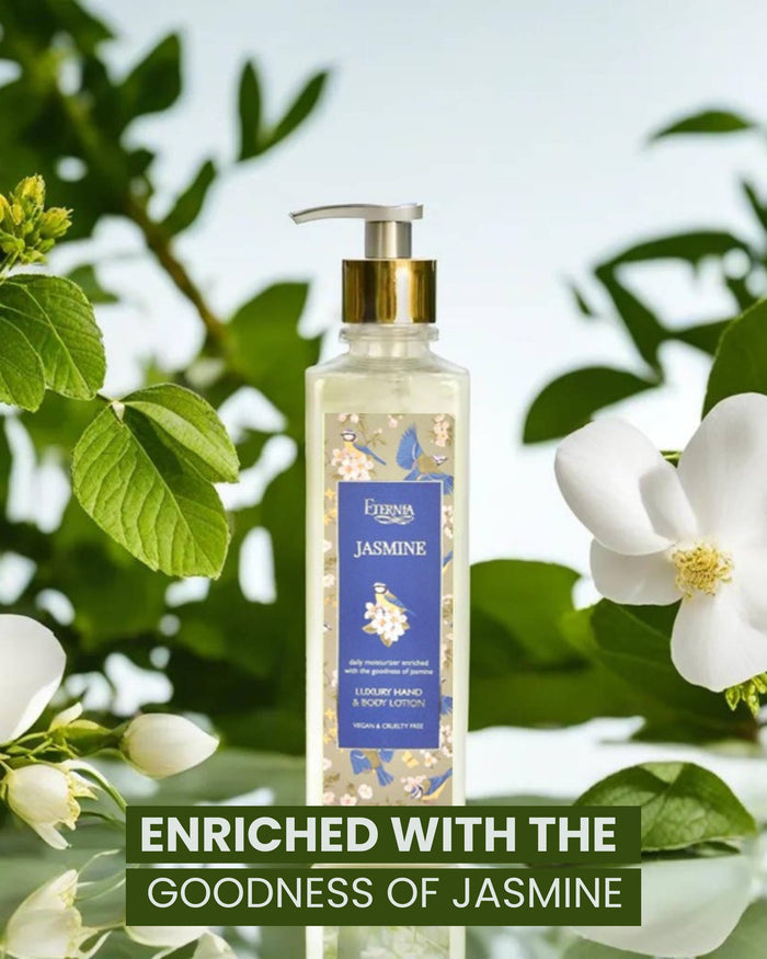 Jasmine hand & body lotion bottle with gold pump among white flowers