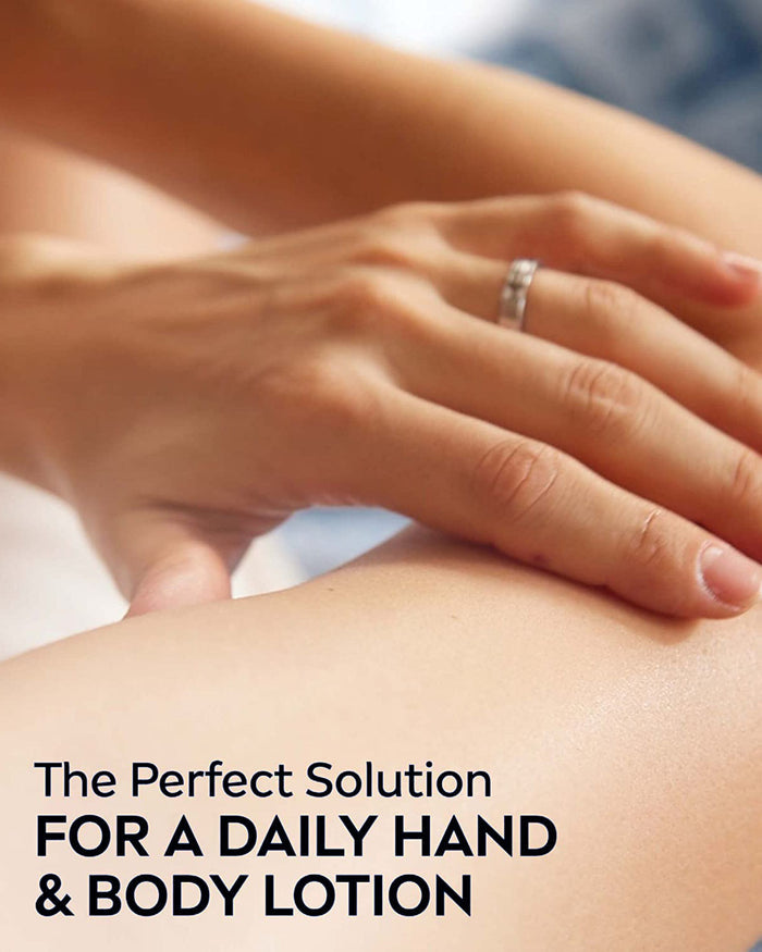 Hand applying lotion to skin, daily hand and body use