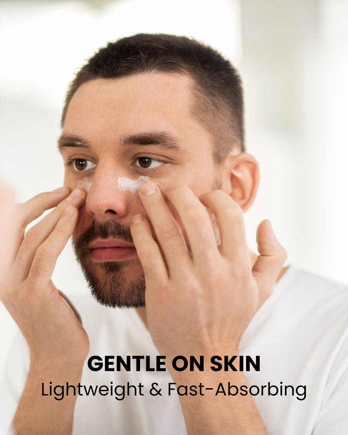 Man applying lotion around eyes and cheeks, gentle skincare