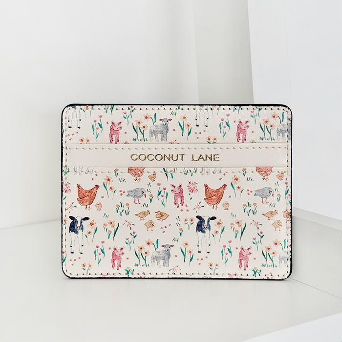 Vegan leather card holder with colorful illustrated farm animals, designed by Coconut Lane.