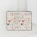 Vegan leather card holder with colorful illustrated farm animals, designed by Coconut Lane.
