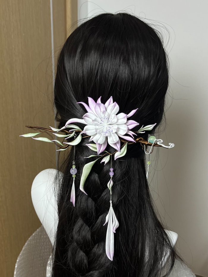 Handmade Chanhua hair ornament with a flower, leaves, and tassels