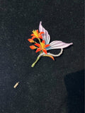 Handmade Chanhua fish - tail galangal lily brooch with orange - red flowers, pastel leaves and pearl accents