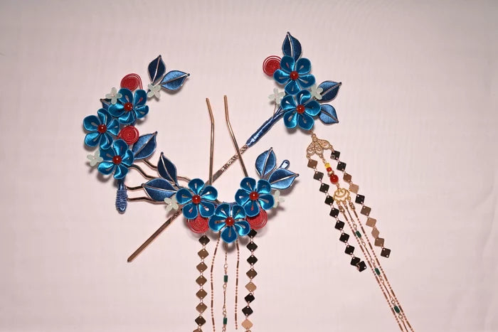 A woman wearing a handmade Chanhua imitation Diancui hair set with colorful flowers and tassels-2
