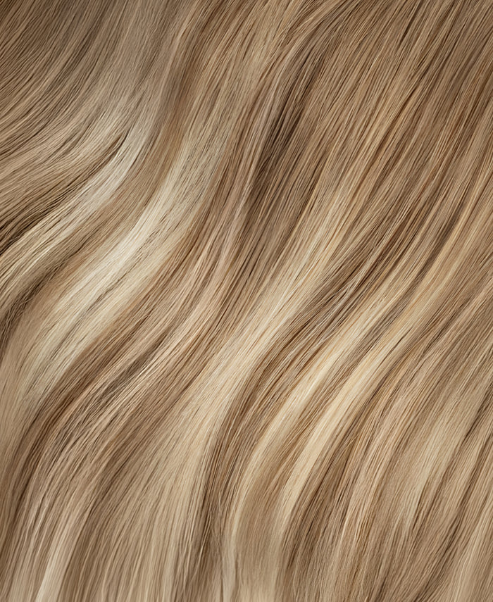 invisible clip-in hair extensions rooted blonde highlights.