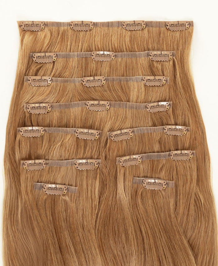 invisible clip-in hair extensions strawberry blonde.