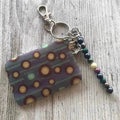 Keyring featuring tractor tyres design, size 65mm x 45mm