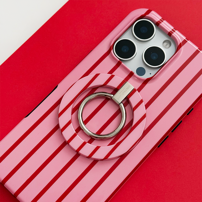 Coconut Lane MAGSAFE® Phone Ring in Cherry Stripes pattern beside a matching striped phone case on a red and white surface.