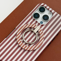 Coconut Lane MAGSAFE® phone ring with chestnut stripes attached to a smartphone case on a brown surface.