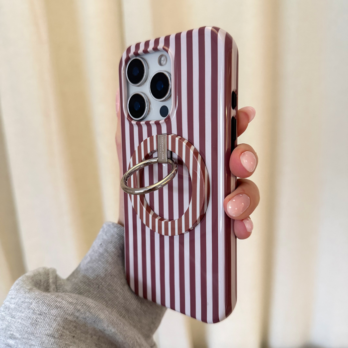 Hand holding iPhone with Coconut Lane MAGSAFE® case and phone ring in a brown striped Chestnut pattern.