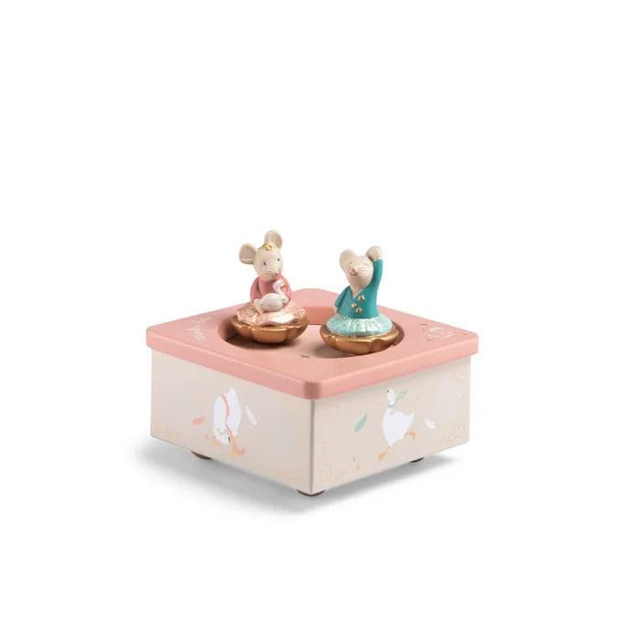 A musical box with a pink base, featuring two mouse figures dancing on the box.