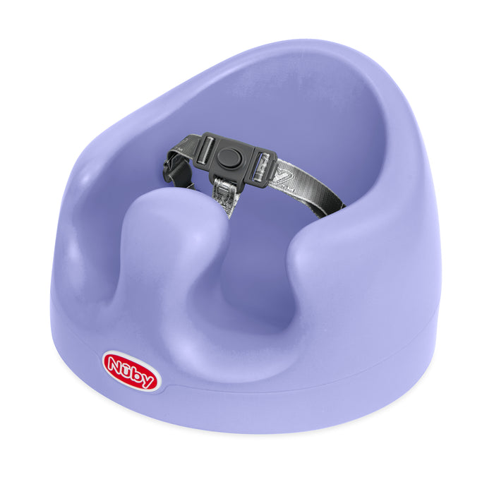 My Floor Seat is a lavender ergonomic baby seat with a built-in safety harness and supportive leg openings, designed to help babies sit upright.