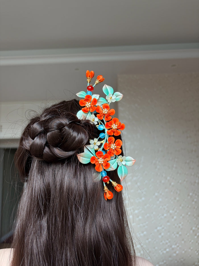 Orange - colored handmade Chanhua hair comb on a woman's hair-5