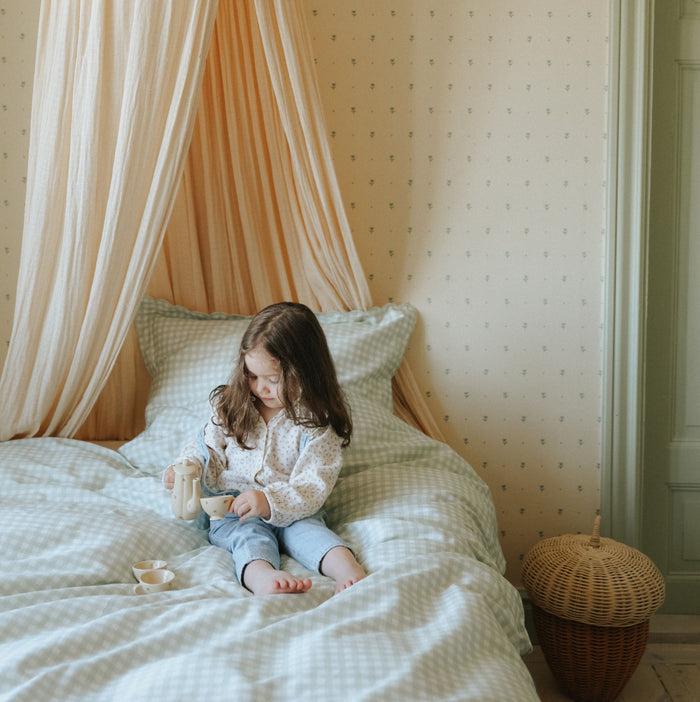Picnic Gingham Green Twin Set with little girl playing tea on bed