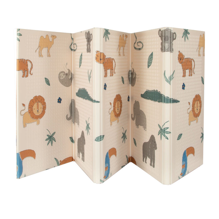 The Reversible Floor Mat | Safari is a portable baby mat with a beige background, decorated with cartoon lions, elephants, tigers, camels, crocodiles, sloths, and leafy plants.