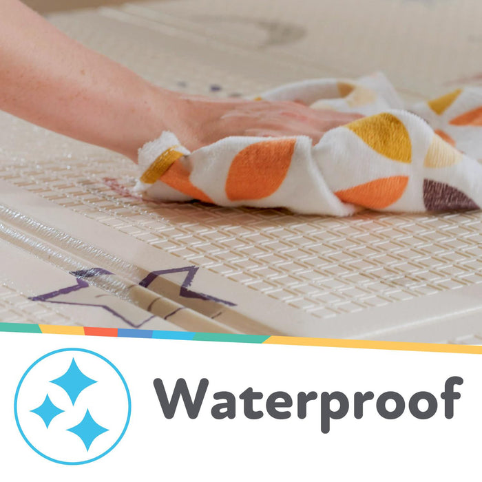 A hand wipes water from the Reversible Floor Mat | Safari, highlighting its textured, waterproof, and foldable design. A "Waterproof" label appears below with a blue sparkling icon.