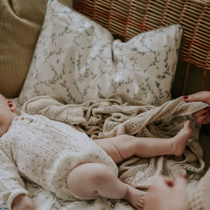 Baby playing with Mother, with the Secret Garden Standard Pillowcase Set in Ivory print in the background