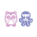 The Nuby Silicone Mini Teethers (2 Pack) includes a pink owl and purple octopus teether, both with cutout designs and textured surfaces to help soothe babies during teething.