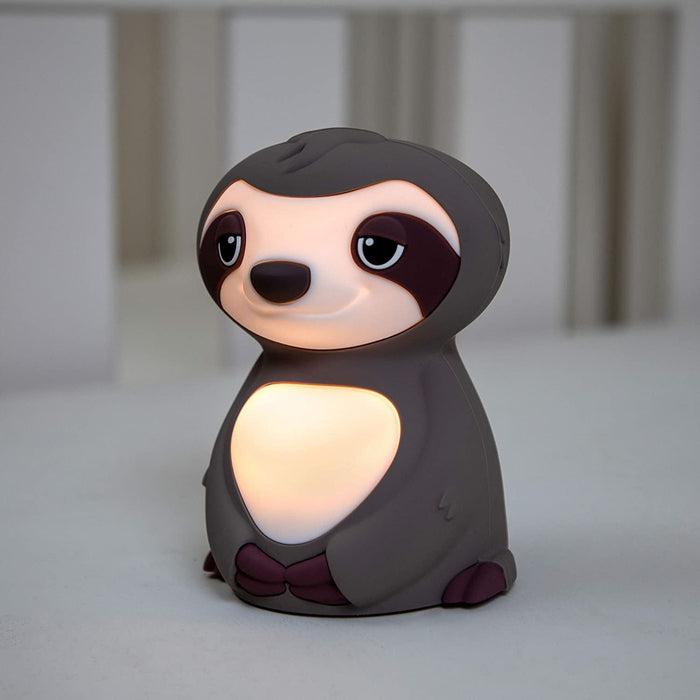 The Silicone Nightlight is a cute gray and white sloth-shaped lamp that softly glows, making it perfect as a nightlight for kids.