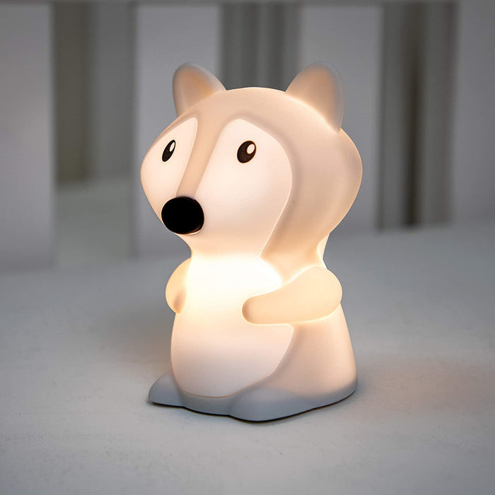 The Silicone Nightlight, shaped like a cute cartoon fox, glows softly with color-changing light on a white surface and is perfect for kids' rooms.