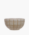 A beige stoneware bowl with a debossed geometric grid pattern and a light glaze. | Wildwood Home Co.