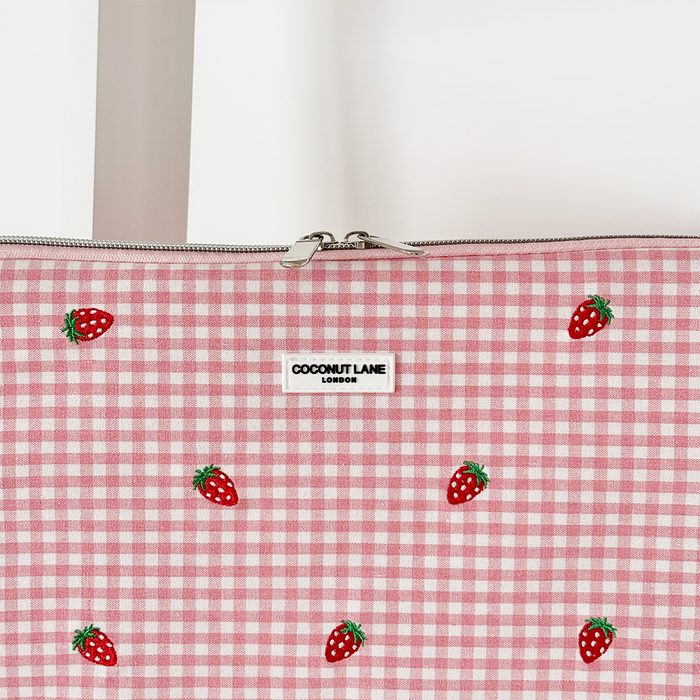 Pink and white gingham zip pouch with embroidered strawberries on the front.