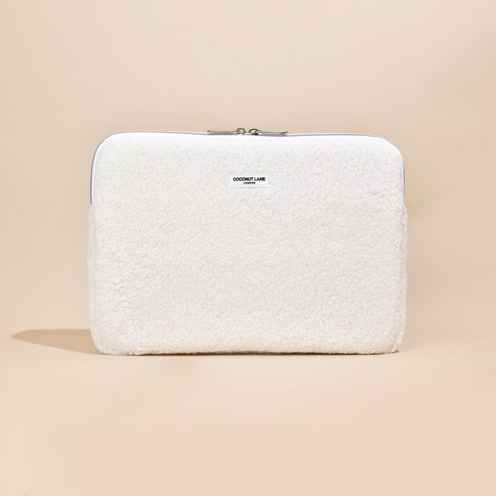 White fluffy Coconut Lane laptop sleeve with zip closure.