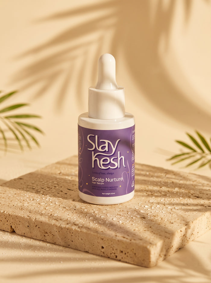 Slaykesh Scalp Nurture Hair Serum bottle on stone slab