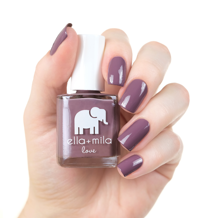 You and Me grey purple nail polish manicure on a light skin tone with the bottle